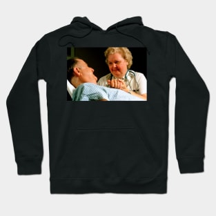 Geriatric care: elderly man reassured by nurse (M540/0193) Hoodie